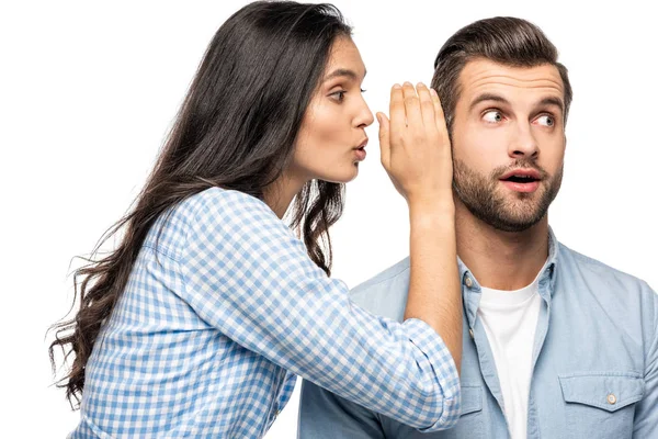 Young woman telling secret to shocked man Isolated On White — Stock Photo