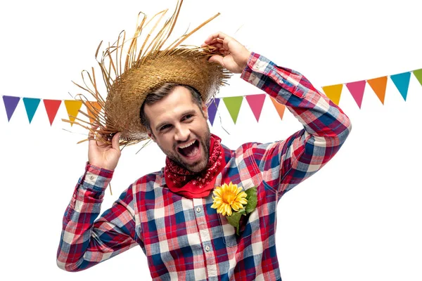 Uomo eccitato in cappello di paglia con girasole in tasca isolato su bianco — Foto stock