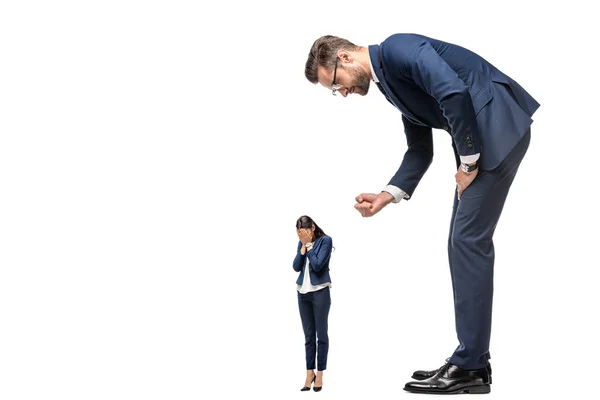 Big businessman showing clenched fist at crying small businesswoman Isolated On White — Stock Photo