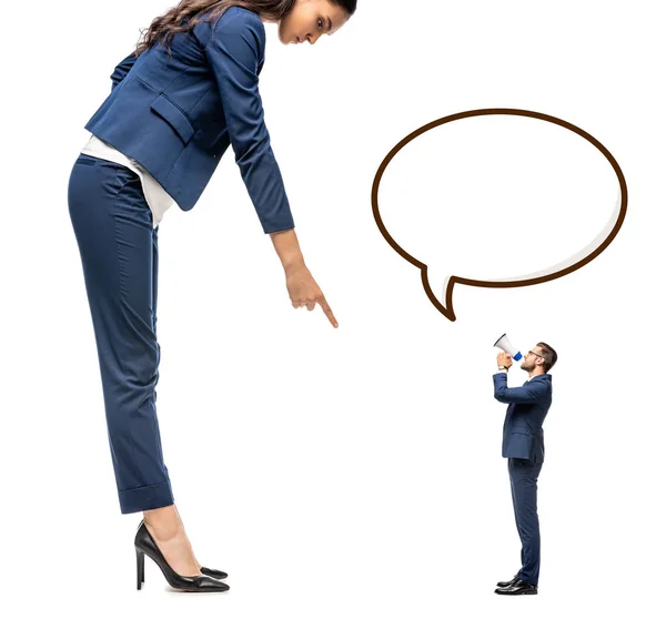 Small businessman shouting in mouthpiece at big businesswoman pointing with finger Isolated On White with Speech Bubble — Stock Photo