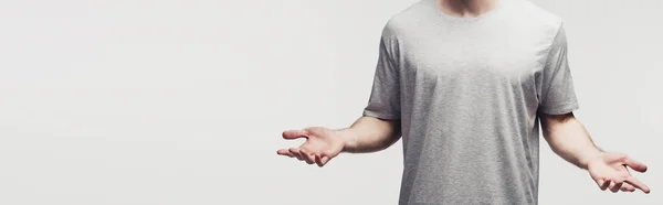 Cropped view of man in grey t-shirt showing shrug gesture isolated on grey, panoramic shot, human emotion and expression concept — Stock Photo