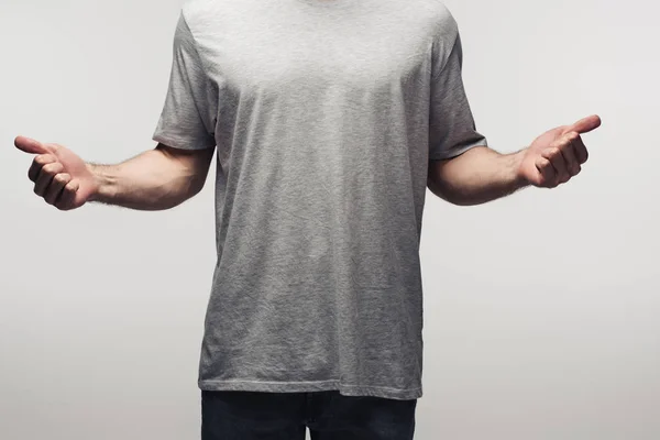 Partial view of man in grey shirt showing thumbs up isolated on grey, human emotion and expression concept — Stock Photo