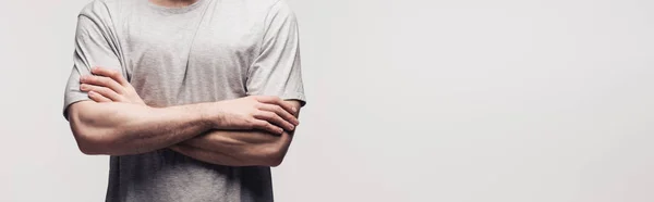 Cropped view of man standing with crossed arms isolated on grey, panoramic shot, human emotion and expression concept — Stock Photo