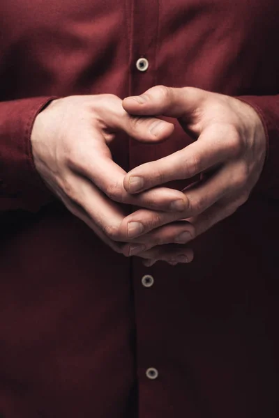 Partial view of man gesturing with clenched hands, human emotion and expression concept — Stock Photo
