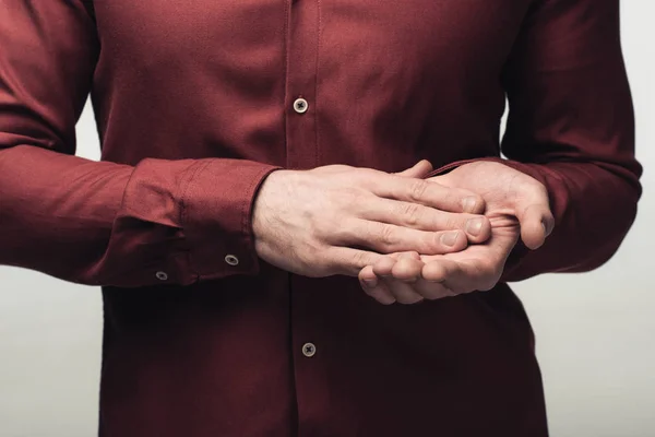 Partial view of man clapping hands isolated on grey, human emotion and expression concept — Stock Photo