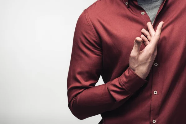 Partial view of confident man gesturing with hand isolated on grey, human emotion and expression concept — Stock Photo