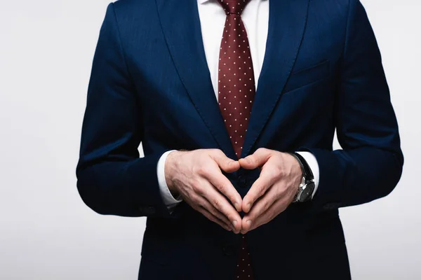 Visión parcial de empresario confiado mostrando gesto de campanario aislado en gris, emoción humana y concepto de expresión - foto de stock