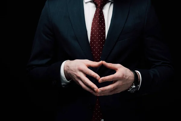 Visão parcial do empresário confiante mostrando gesto íngreme isolado no negro, emoção humana e conceito de expressão — Fotografia de Stock
