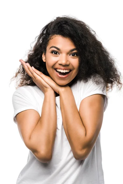 Happy african american woman in white t-shirt standing isolated on white — Stock Photo
