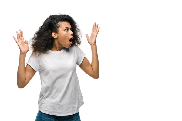 Shocked african american woman gesturing isolated on white — Stock Photo