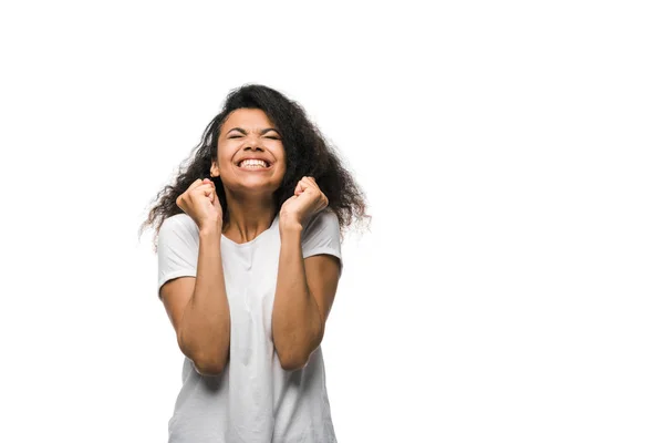 Excited curly african american woman celebrating triumph isolated on white — Stock Photo