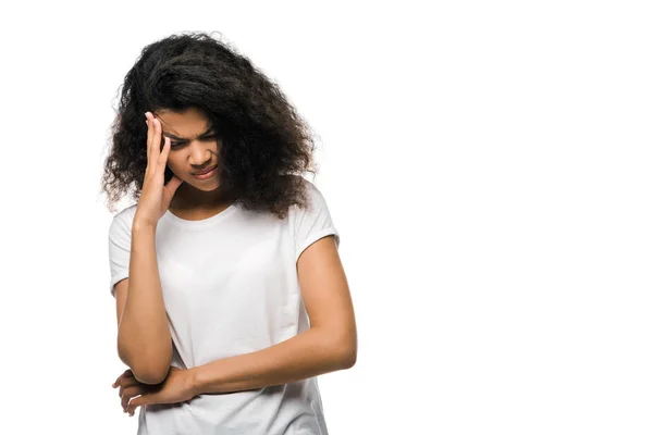 African american woman in white t-shirt touching head isolated on white — Stock Photo