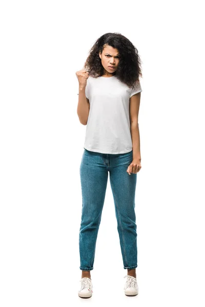 Angry curly african american girl in white t-shirt showing fist isolated on white — Stock Photo