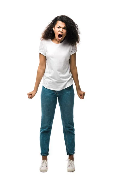 Irritated african american woman standing and screaming isolated on white — Stock Photo