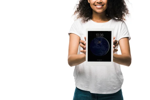 KYIV, UKRAINE - MAY 29, 2019: cropped view of happy african american girl holding ipad isolated on white — Stock Photo