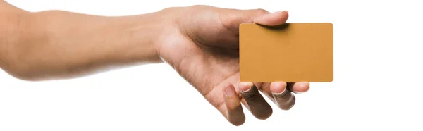 Panoramic shot of african american woman holding credit card isolated on white — Stock Photo