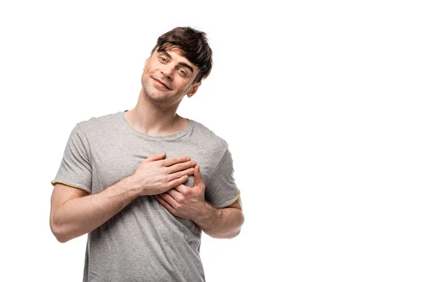 Fröhlicher gutaussehender Mann zeigt Liebesgeste, während er isoliert auf weiß in die Kamera schaut — Stockfoto