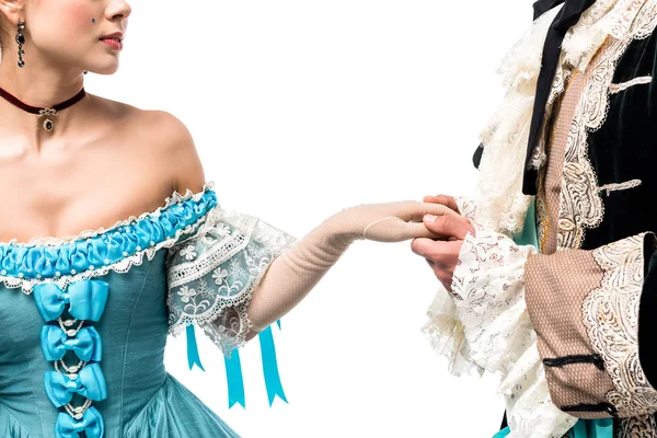 Vista recortada de caballero cogido de la mano con la mujer victoriana en vestido azul aislado en blanco - foto de stock