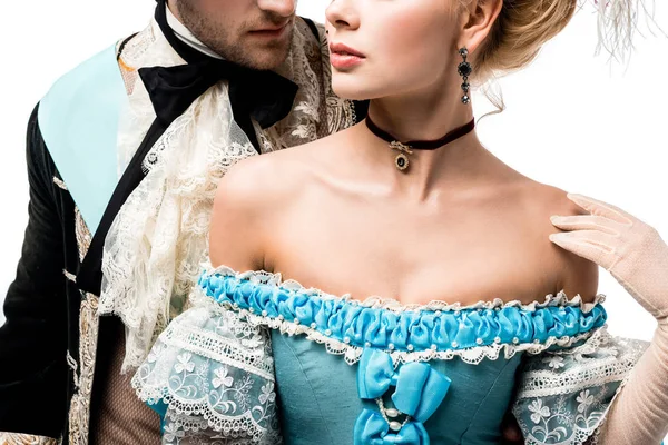 Cropped view of pompous victorian man near young woman in blue dress isolated on white — Stock Photo