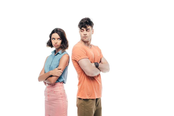 Offended man and woman standing back to back with crossed arms isolated on white — Stock Photo