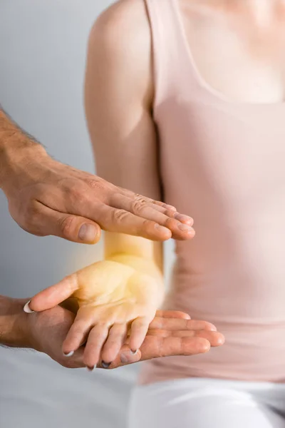 Partial view of woman and healer cleaning her aura — Stock Photo