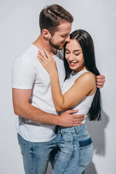 Happy couple of two people in love smiling while hugging each other — Stock Photo