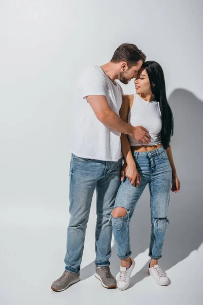 Full length view of couple in love hugging with closed eyes — Stock Photo