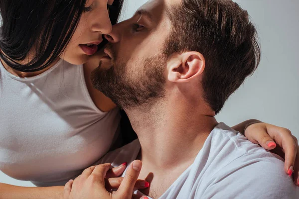 Portrait shot of young couple in love trying to kiss each other — Stock Photo