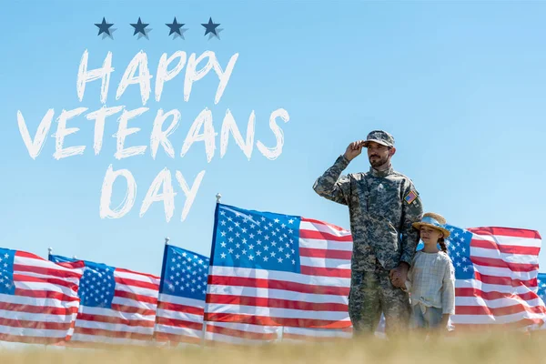 Selective focus of father in military uniform standing with cute kid near american flags with happy veterans day illustration — Stock Photo