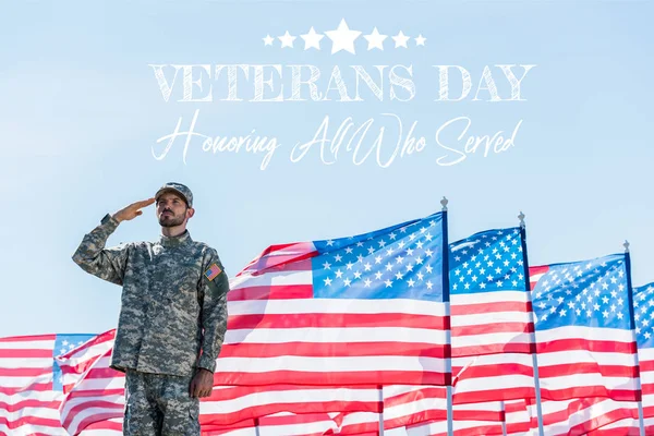 Patriotic soldier in military uniform giving salute near american flags with stars and stripes with veterans day, honoring all who served illustration — Stock Photo