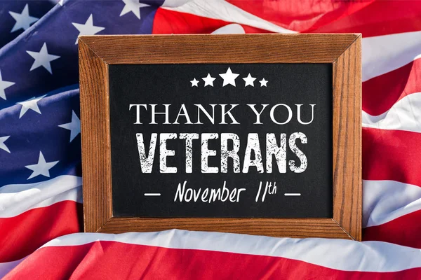 Chalkboard  with thank you veterans illustration on american flag with stars and stripes — Stock Photo