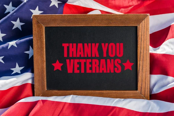 Chalkboard  with thank you veterans illustration on american flag with stars and stripes — Stock Photo