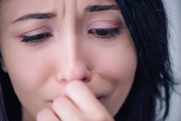 Close up of beautiful depressed woman covering mouth at home — Stock Photo