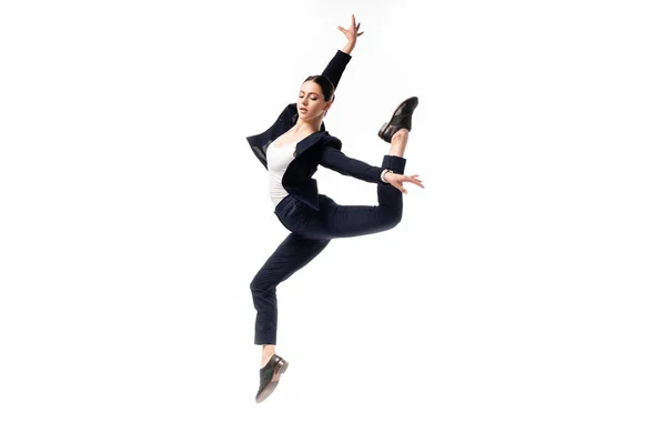 Attractive businesswoman in black formal wear dancing isolated on white — Stock Photo