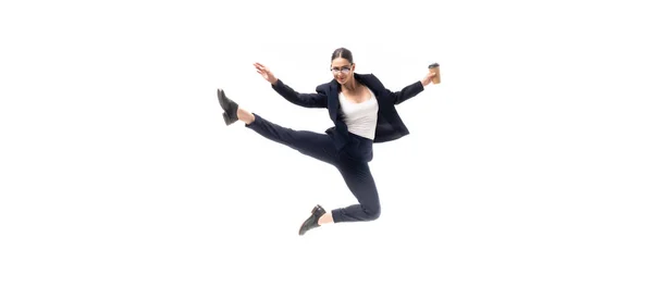 Panoramic shot of young businesswoman dancing with coffee to go isolated on white — Stock Photo