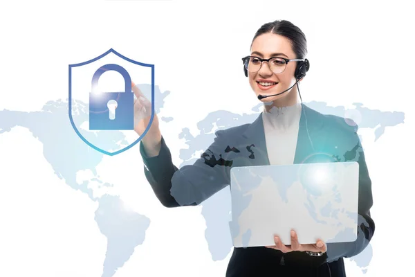 Call center operator holding laptop while pointing with finger at safety lock icon near world map isolated on white — Stock Photo