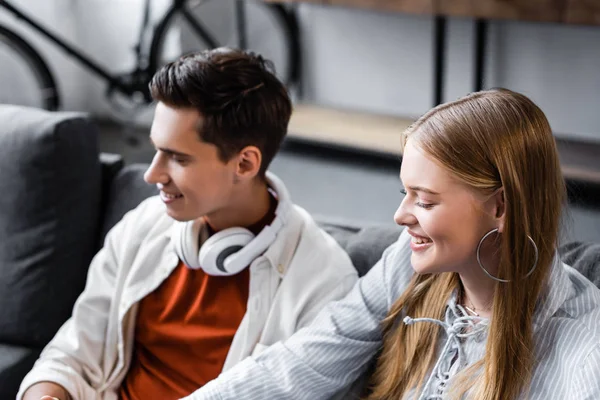 Handsome and attractive friends with closed eyes smiling in apartment — Stock Photo