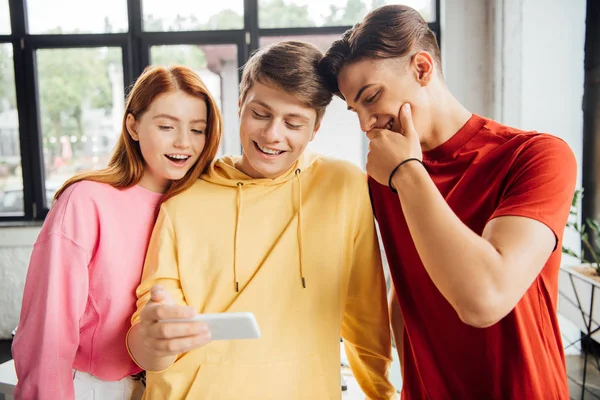 Three friends taking selfie and smiling in school — Stock Photo