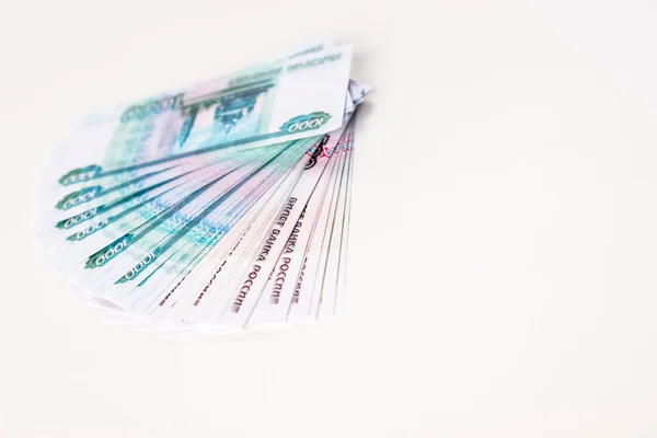 Selective focus of russian banknotes isolated on white with copy space — Stock Photo