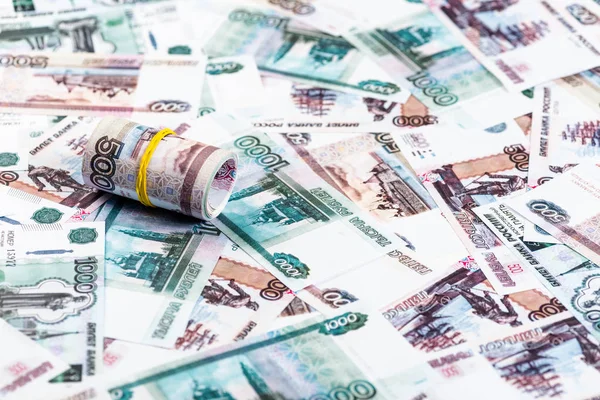 Selective focus of cash roll on russian banknotes — Stock Photo