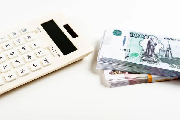 Modern calculator with buttons near russian money on white — Stock Photo