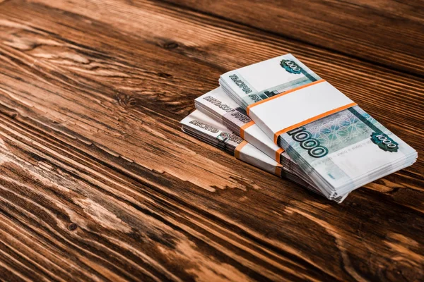 Russian paper money in cash on wooden table — Stock Photo