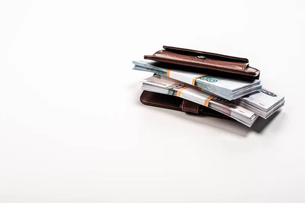 Stacks with russian money in leather wallet on white — Stock Photo