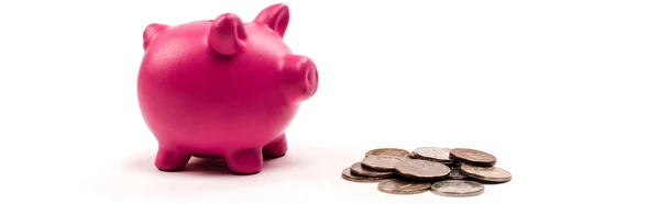 Panoramic shot of pink piggy bank near silver and golden coins on white — Stock Photo