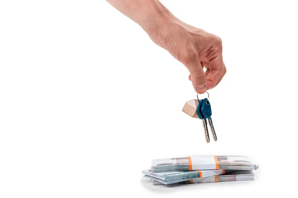 Cropped view of man holding keys near russian money isolated on white — Stock Photo