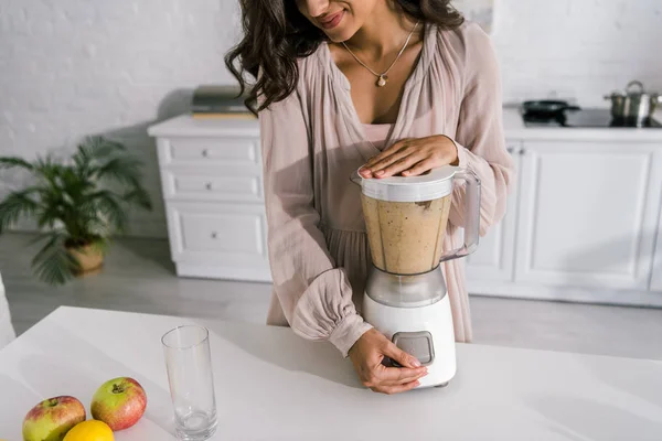 Cropped view of cheerful pregnant woman preparing smoothie — Stock Photo