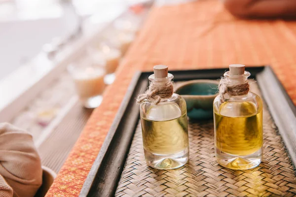 Selective focus of bottle with fragrance oils in spa salon — Stock Photo