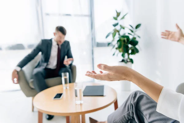 Cropped view of journalist talking with handsome businessman in suit — Stock Photo