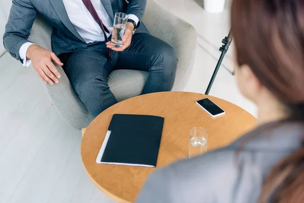 Selective focus of journalist and businessman in formal wear — Stock Photo