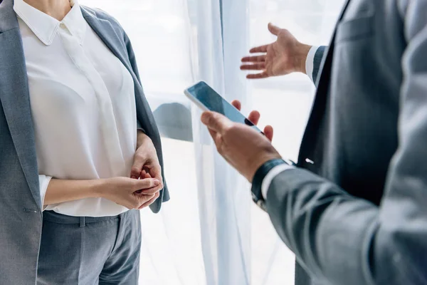 Cropped view of journalist talking with businessman in formal wear — Stock Photo